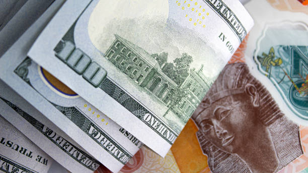 istock dollar and Egyptian banknotes currency exchange concept 1952887572