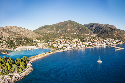 The spa town of Methana peninsula with its two steep volcanic slopes and the islet Agii Anargyri in Peloponnese, Greece