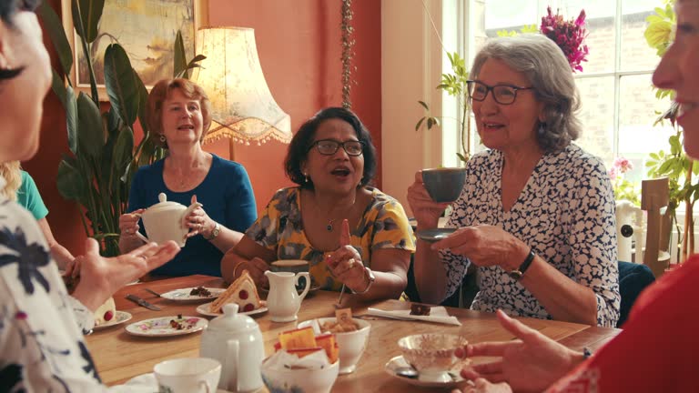 Friends Engage in Light-hearted Conversations in Cafe