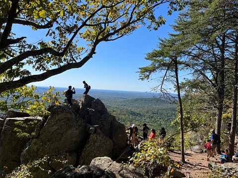 Gastonia, North Carolina, United States - 8 Feb 2022:  Visitors of Crowders Mountain in North Carolina enjoying the view.