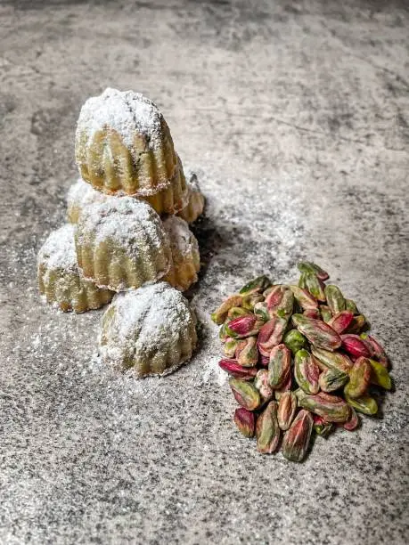 Delicious Middle Eastern pastry, pistachio mamoul features a buttery semolina crust filled with sweet pistachio filling, creating a delightful treat.