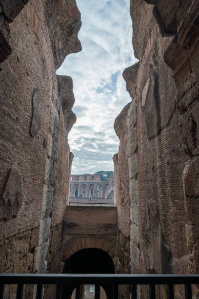 istock Ancient Stone Archway in Historical Structure with View of Ruins 1952931115