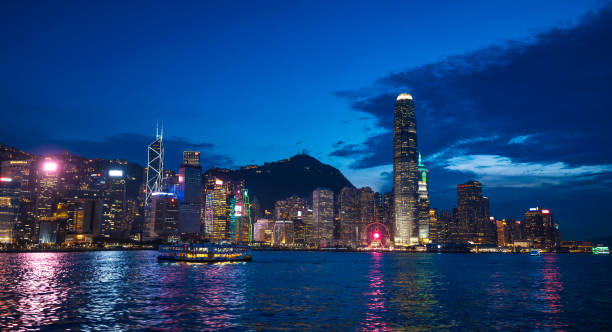 istock Vibrant Hong Kong Skyline and Harbor at Night 1952933756
