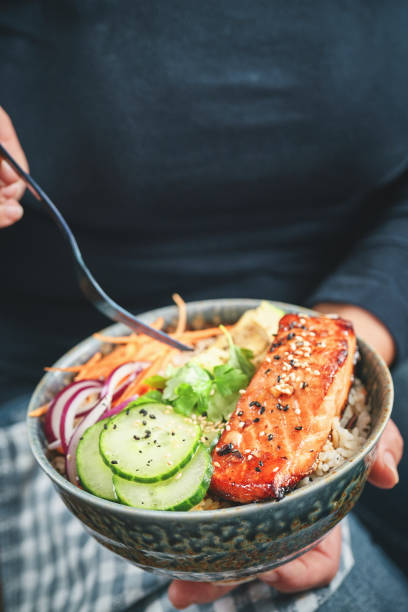 istock Spicy Salmon Bowl with Rice, Carrots, Cucumber and Avocado 1952950149
