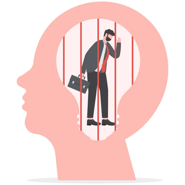 istock business man sad is sitting and crying in a screaming head prison fixed mindset concept 1952954372