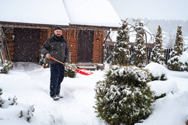 istock A man works removing snow with a shovel. 1952961859