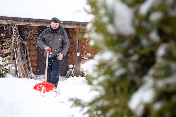istock A man works removing snow with a shovel. 1952962914