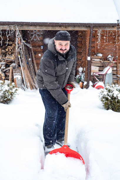 istock A man works removing snow with a shovel. 1952963454