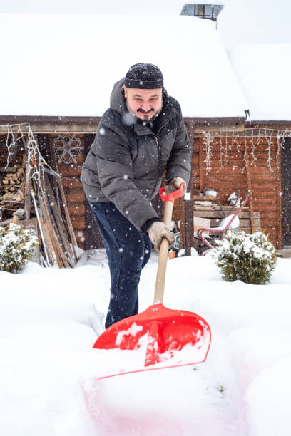 istock A man works removing snow with a shovel. 1952963457
