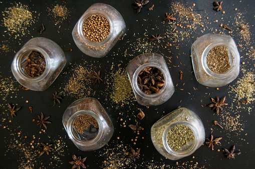 Different spices in jars. Cooking backgrounds