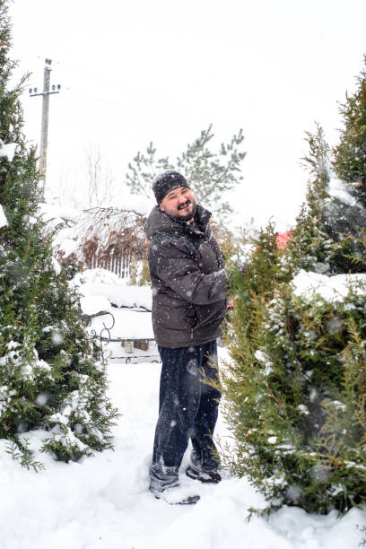 istock A man works removing snow with a shovel. 1952969034