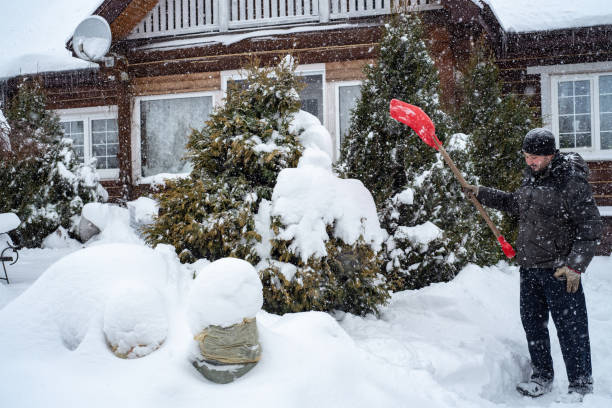 istock A man works removing snow with a shovel. 1952970184