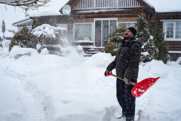 istock A man works removing snow with a shovel. 1952970223