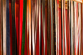 Leather belts hanging in a store