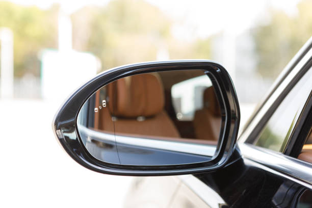 istock left rear view mirror in a luxury car with a reflection of a brown leather interior 1952987100