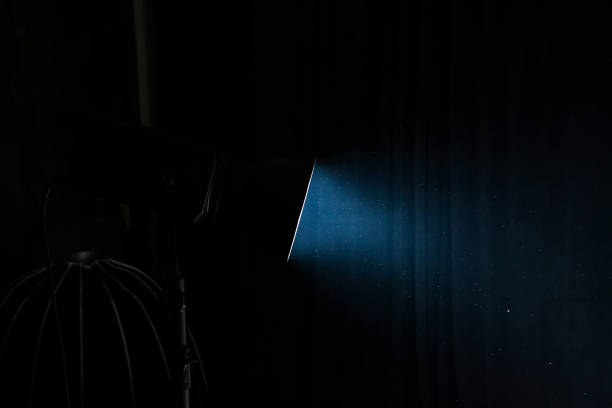 istock Spotlight with one studio light on dark background. Professional lighting equipment for photo studios. 1952990328