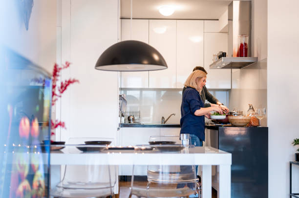istock Couple preparing lunch at home 1952993779