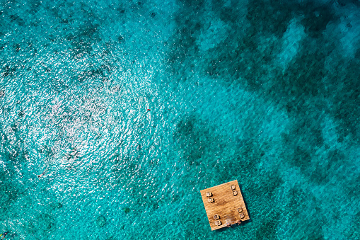 Elevated view of floating dock lounge area at Playa Kalki, Curacao