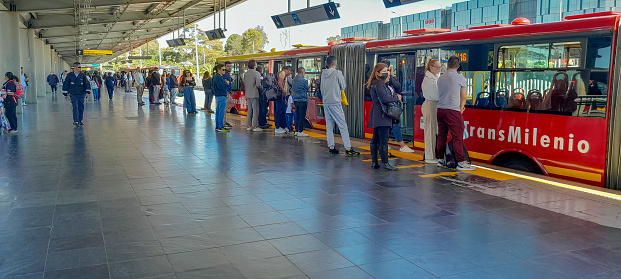 People in line waiting for a bus at the transmilenio station in Bogota Colombia Jan 22/2024