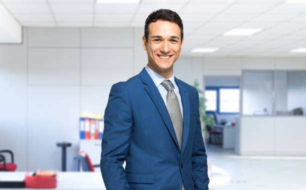 Smiling businessman in his office - foto stock
