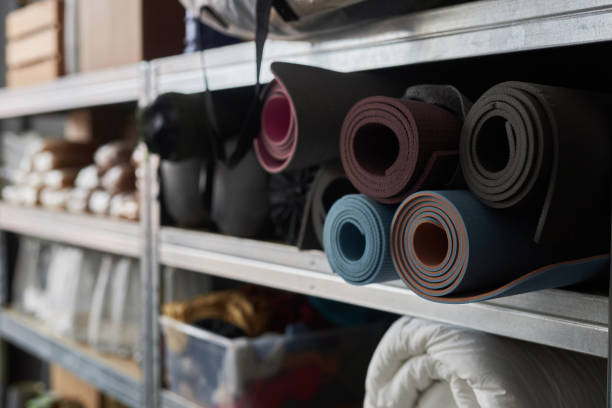 istock Sleeping Mats Rolled and Stacked on Shelf in Warehouse 1953029782