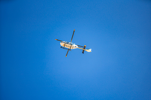 Valencia, Spain. October 9, 2023. Helicopter of the Spanish national police over Valencia during local holiday