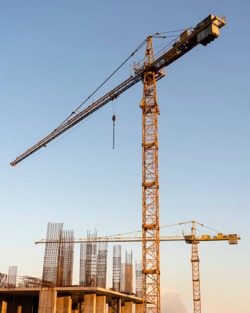 istock tower cranes at construction site and city background 1953074229