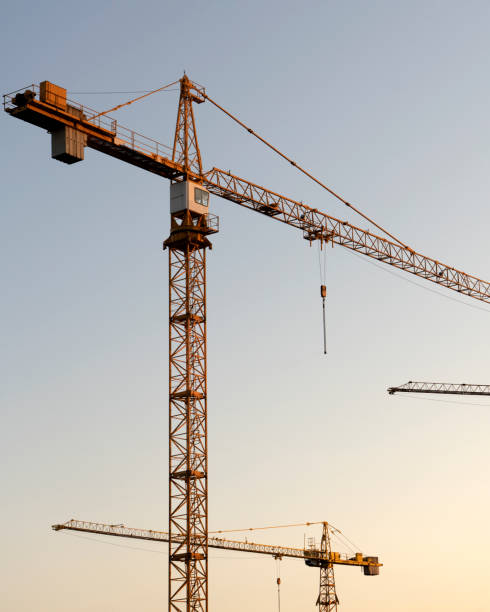 istock tower cranes at construction site and city background 1953075880