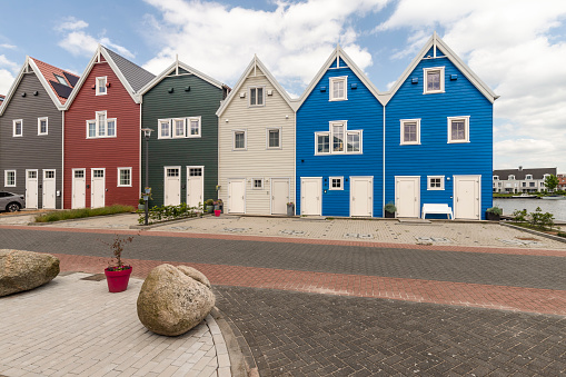 Colored boathouses in the city of Harderwijk in Gelderland.