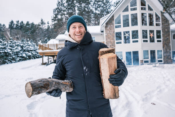 istock Young man starting outdoor fire in winter 1953126481