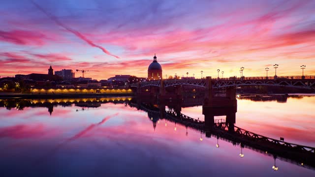 Toulouse day to night sunset timelapse showing the amazing river and historic buildings. France