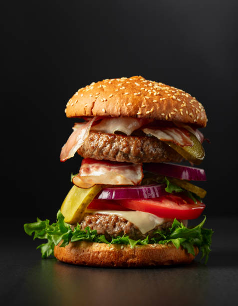 istock Fresh tasty burger on a black background. 1953149465