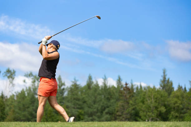 istock Woman Golfer Swing in Golf Course 1953150529