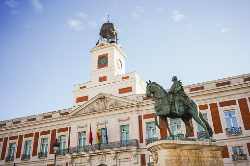 A majestic equestrian statue stands before the historic building on January 20, 2024, in Madrid, Spain