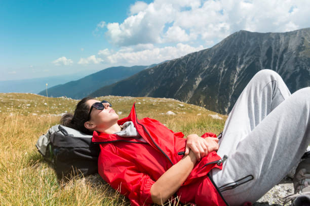 istock Woman  lying down in the summer  mountain 1953183244