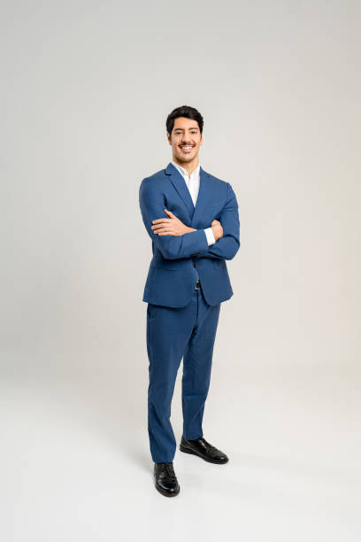 istock Standing tall and exuding confidence, this young businessman in a blue suit 1953196630