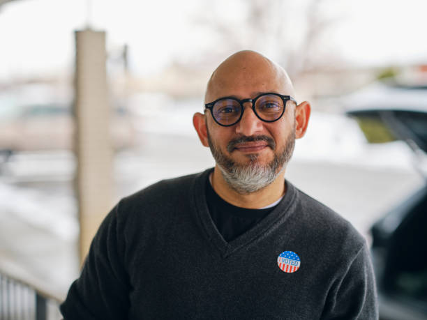 istock Mature Man With I VOTED Sticker 1953200160
