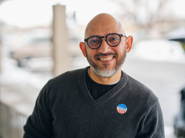 istock Mature Man With I VOTED Sticker 1953200173