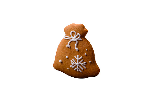Beautiful delicious sweet winter Christmas gingerbread cookies on a bronze textured background. Preparing for a family holiday