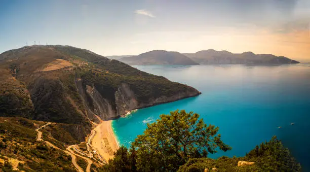 Photo of Top view Panoramic view of the famous Myrtos beach on Kefalonia island, Ionian sea, Greece. Myrtos beach with turquoise sea water on Cephalonia Greek island