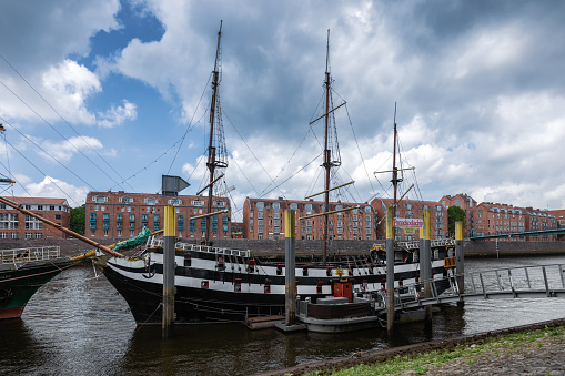 Hamburg, Germany - June 25, 2022: Side of the Rickmer Rickmers, a museum ship in the Port of Hamburg, with the Elbphilharmonie concert hall in the background.