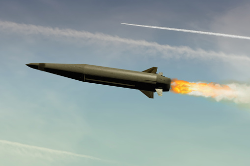 A supersonic Russian Dagger missile in flight against a blue sky. Concept: missile attack