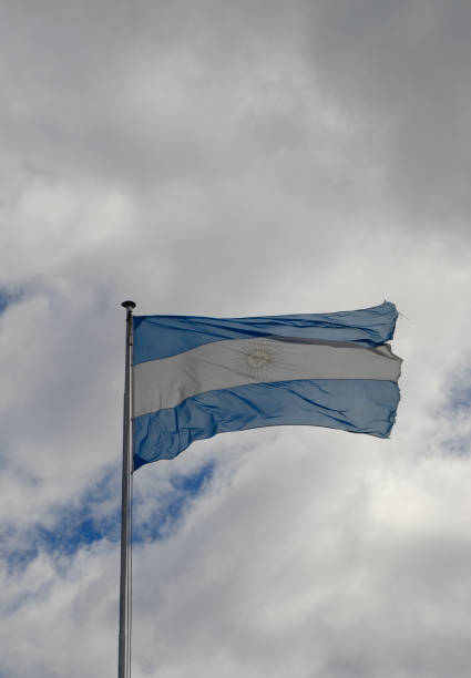 istock Argentine flag flying in the sky, worn flag 1953251659