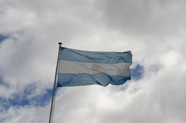 Argentine flag flying on cloudy day