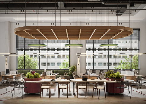 3D rendering of an environmentally friendly coworking office. Three-dimensional image of office space with work desks and large windows.