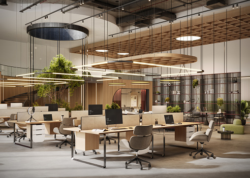 Modern open plan office interior with desks, chairs, computers and pendant lights. 3d render of open plan coworking office space.