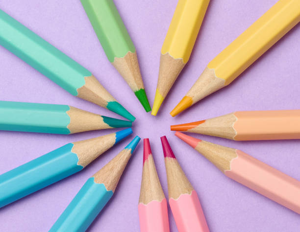 istock Multi-colored wooden pencils on a purple background 1953267641