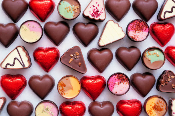 istock Valentines Day chocolate background. Red heart theme. Above view. 1953274770