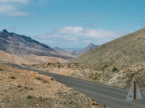 Road trip in the mountain pass of volcanic island of Fuerteventura