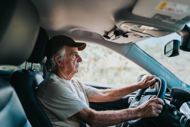istock Elderly man driving in rural area 1953310716